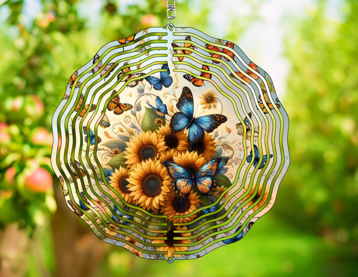 Decorative wind spinner with butterflies and sunflowers against a blurred green outdoor background