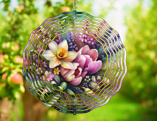 Decorative wind spinner with floral design against a blurred green outdoor background